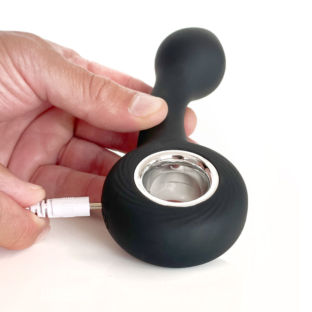 VERS Rechargeable Silicone G Spot Vibe -  13.8 cm USB Rechargeable Vibrator being charged with a USB cable.