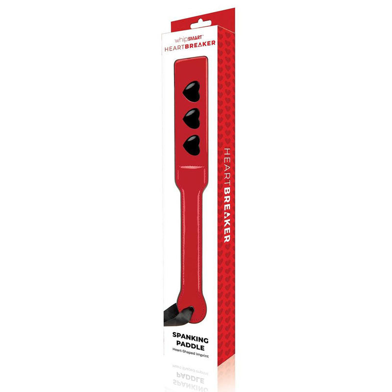 WhipSmart Heartbreaker Spanking Paddle - Spanking Paddle in red packaging with black accents for bold intimate essentials.