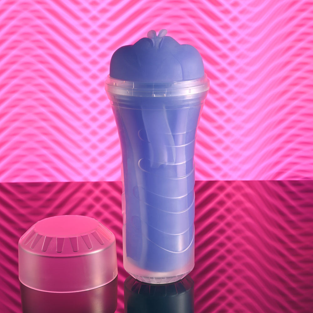 Zero Tolerance POP ON THE GLOW - Glow in Dark Vagina Stroker on a reflective surface with contrasting background.