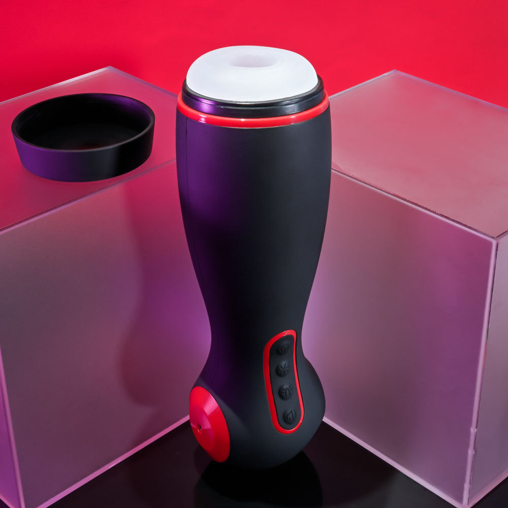 Zero Tolerance TIGHT SQUEEZE - USB Rechargeable Vibrating, Squeezing & Talking Stroker on a colorful background.