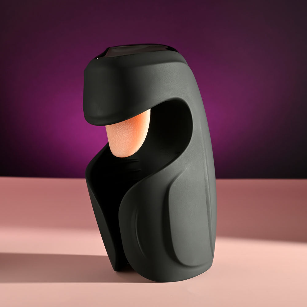Zero Tolerance LICK THE TIP -  USB Rechargeable Vibrating & Flicking Masturbator on display against a purple background.