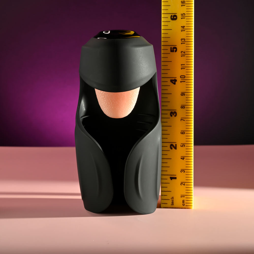 Zero Tolerance LICK THE TIP -  USB Rechargeable Vibrating & Flicking Masturbator next to a ruler for size comparison