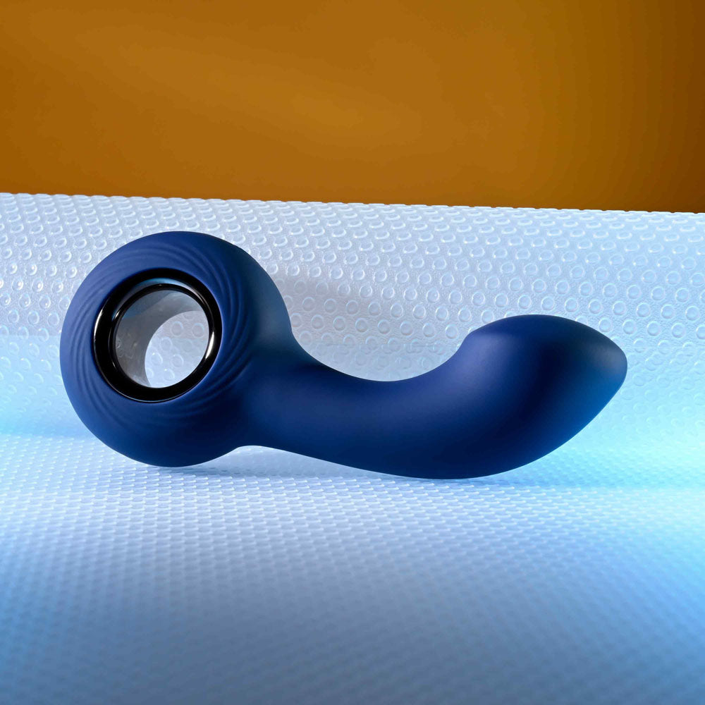 Zero Tolerance THE REACH -  13.8 cm USB Rechargeable Vibrating Anal Plug on a textured surface.
