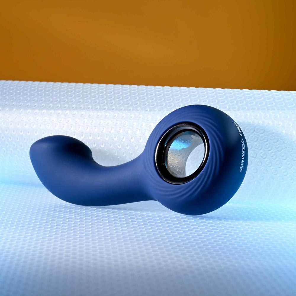 Zero Tolerance THE REACH -  13.8 cm USB Rechargeable Vibrating Anal Plug on textured surface.
