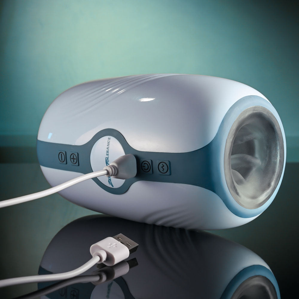 Zero Tolerance TOUCHDOWN - 15 cm USB Rechargeable Vibrating & Tightening Stroker with a USB cable plugged in.