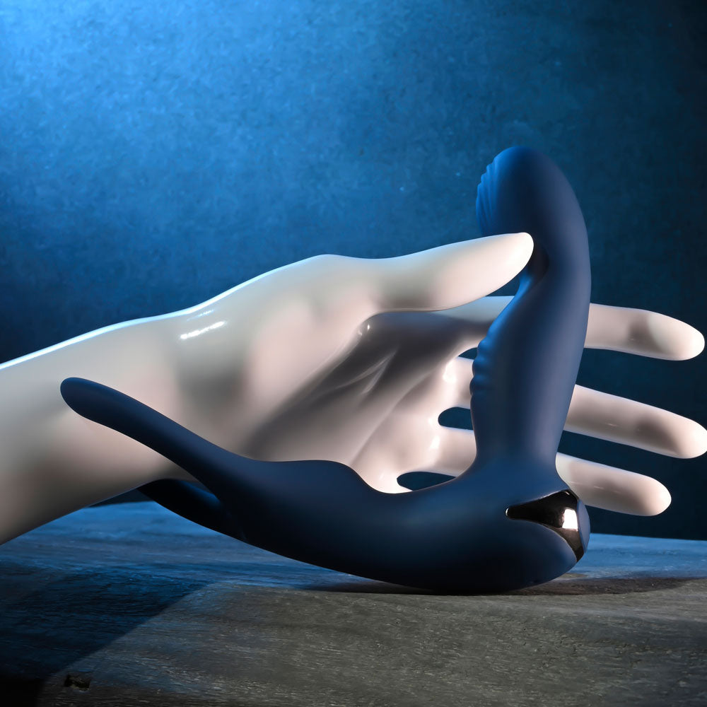 Zero Tolerance BY ALL MEANS - 13.4 cm USB Rechargeable Prostate Massager with Cock Ring in hand.