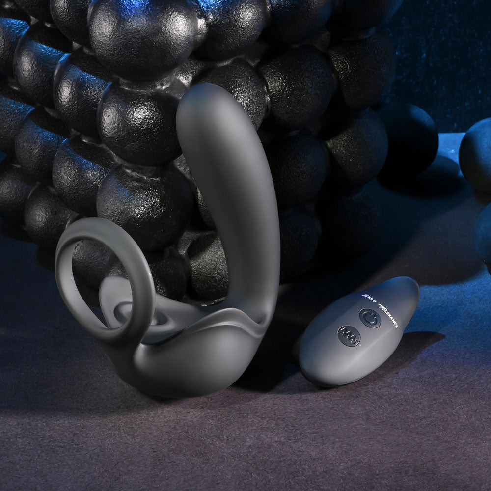 Zero Tolerance BALLIN OUT -  USB Rechargeable Prostate Massager with Cock Ring and Wireless Remote on a textured surface.
