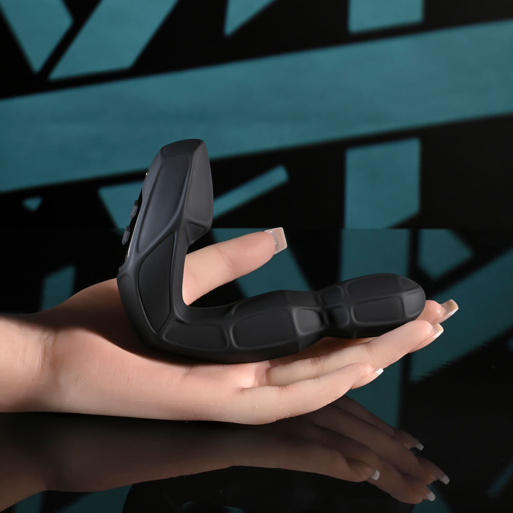 Zero Tolerance MR PROSTATE -  12.6 cm USB Rechargeable Prostate Massager with Wireless Remote in hand displaying its sleek design.