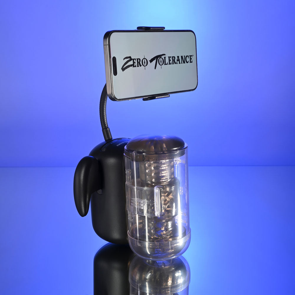 Zero Tolerance HOLD ME TIGHT -  USB Rechargeable Vibrating Auto Stroker with Phone Holder on a reflective surface