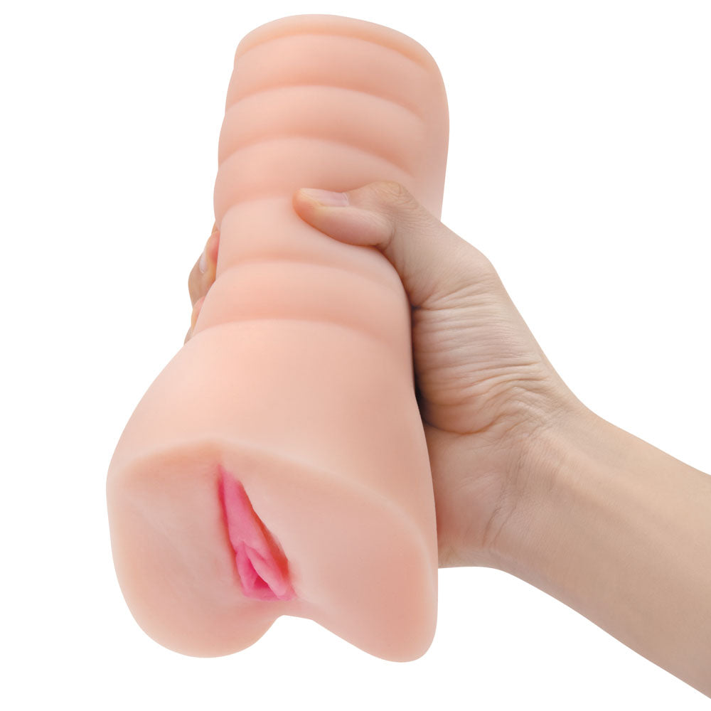 Zolo Stroke Off Virgin Pussy Stroker -  Vagina Stroker held in hand, showcasing realistic texture for intimate pleasure.